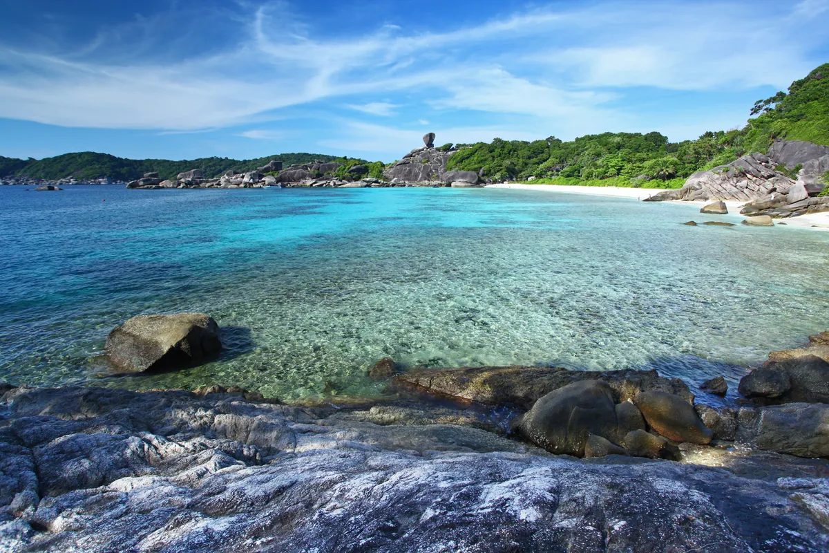 Turquoise water and granite shoreline in the Similan Islands