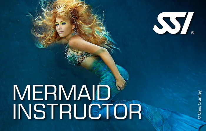 SSI Mermaid Instructor teaching a mermaid course in sheltered shallow water at Khao Lak, Thailand with a student in a mermaid tail
