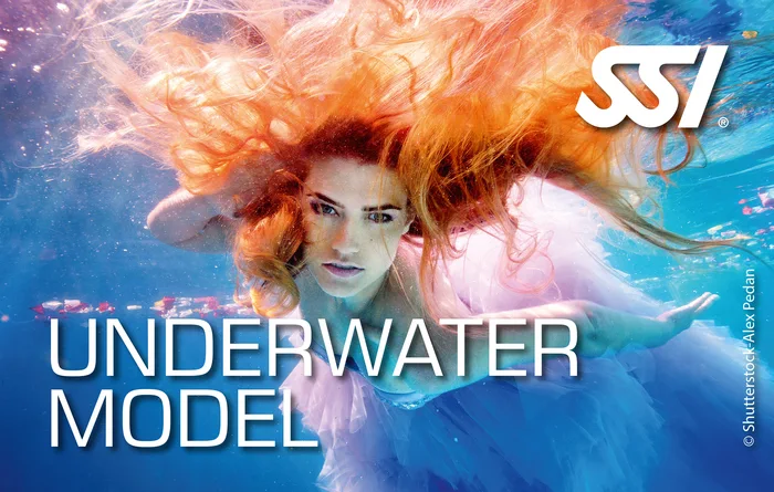 Model Mermaid student posing underwater for an underwater photo shoot in Thailand with a professional mermaid tail
