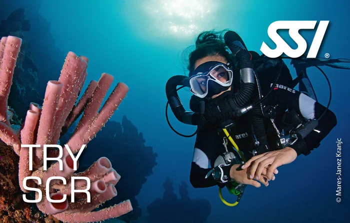 Diver trying the Mares Horizon semi-closed rebreather for the first time in the sheltered shallow water in Khao Lak, Thailand