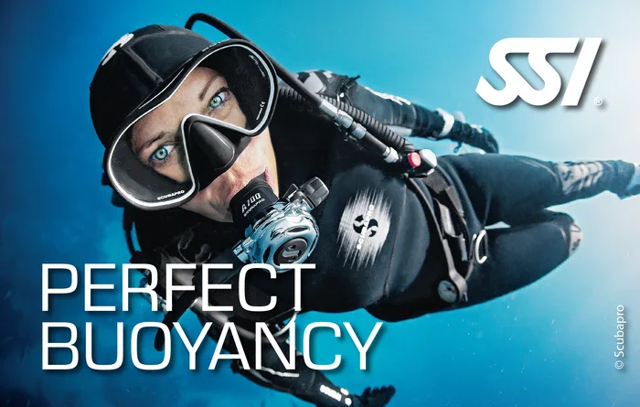 Scuba diver demonstrating perfect neutral buoyancy above a coral reef during an SSI Perfect Buoyancy course in Thailand