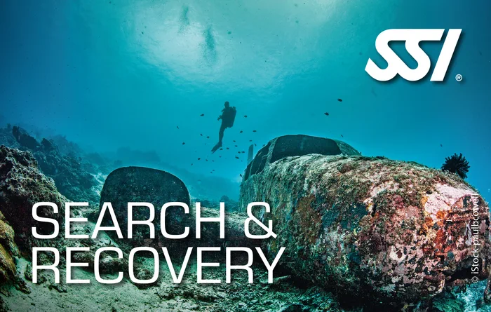Diver using a methodical search pattern underwater during Search and Recovery specialty training