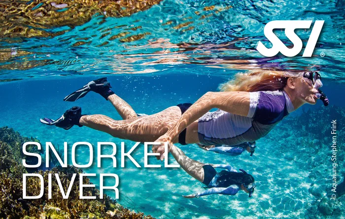 Snorkel Diver student exploring a shallow coral reef in the Andaman Sea