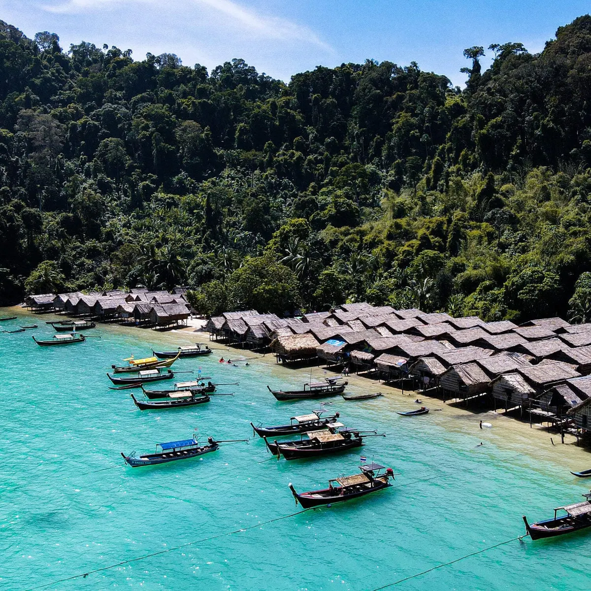 Aerial view of Moken village and longtail boats at Surin